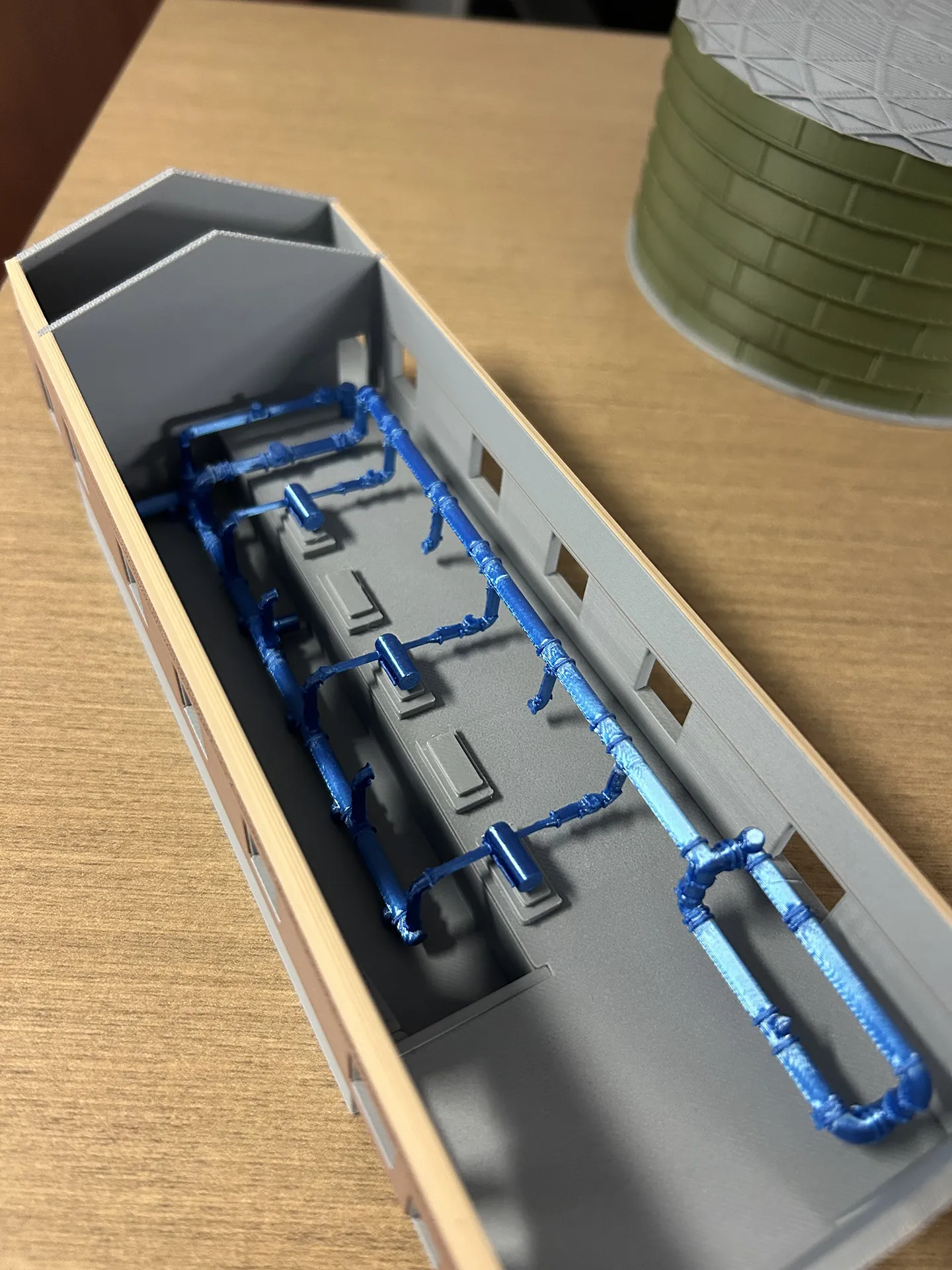 We created a 3D model of the pump station building, internal piping, and the water storage tank, using colors that replicated the final product.