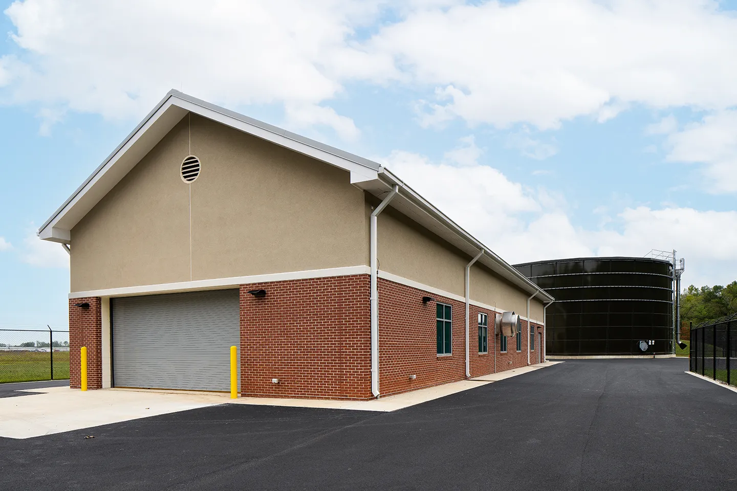 For comparison with the 3D replica, this is the completed building and water storage tank of the Airport East Tank and Pump Station project.