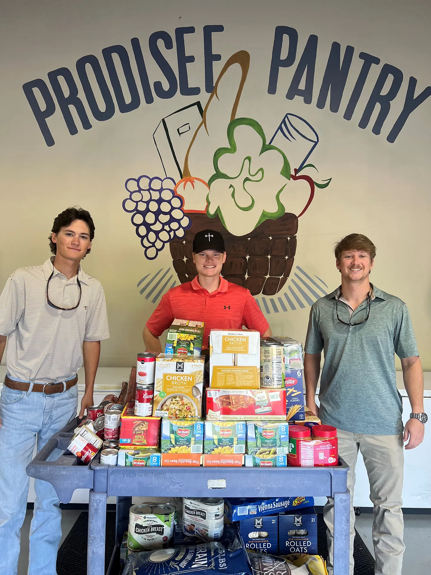 Interns Jacob Dramer, John Hickey, and Jordan Ammons volunteered to support the community of Daphne, Alabama, through a canned-food drive.