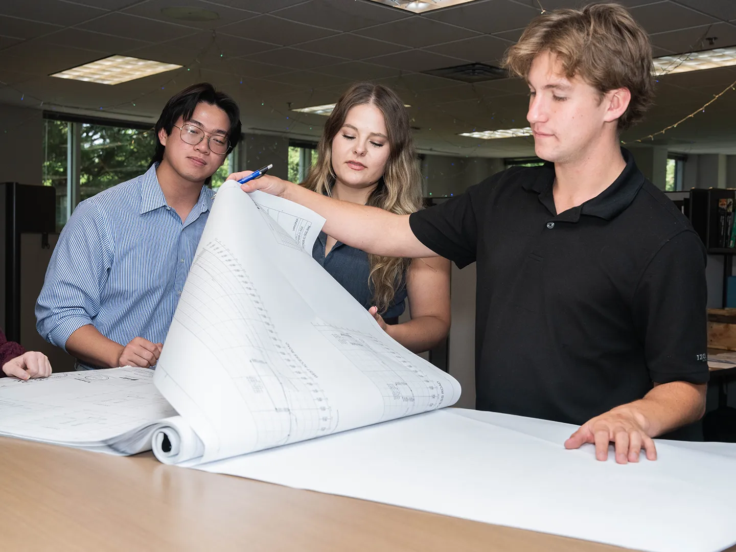 Interns Matthew Lam, Maggie Collins, and Pace Miller collaborating on a project in Richmond, Virginia.