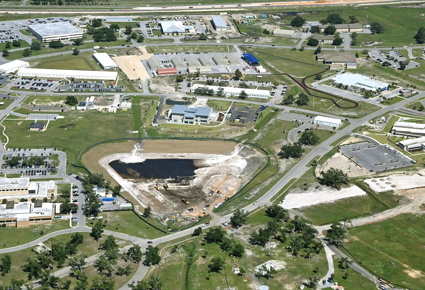 Aerial view of storm pond construction.