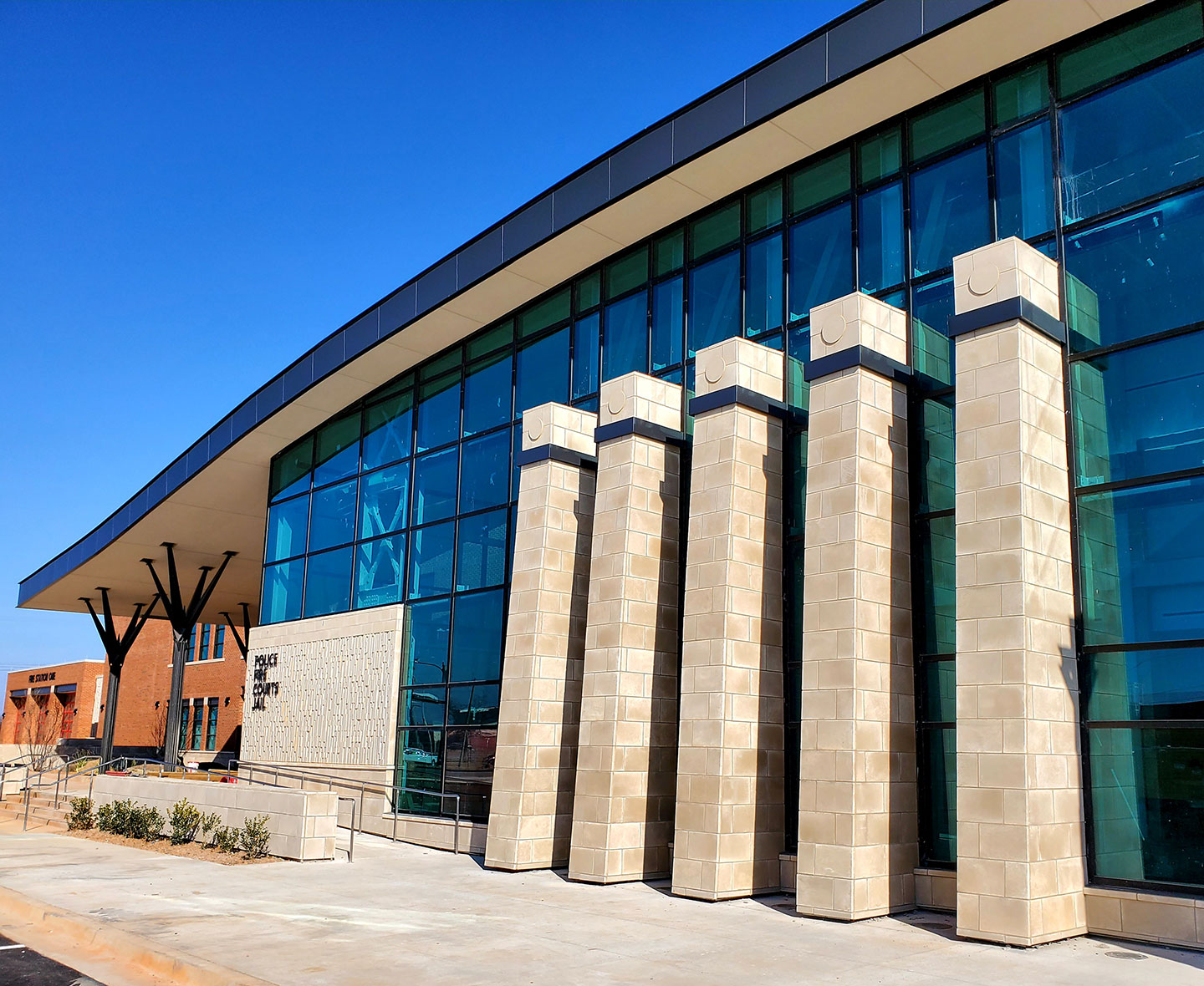 The police station is arranged on three levels, keeping all public services as compact and close to the entry as possible.