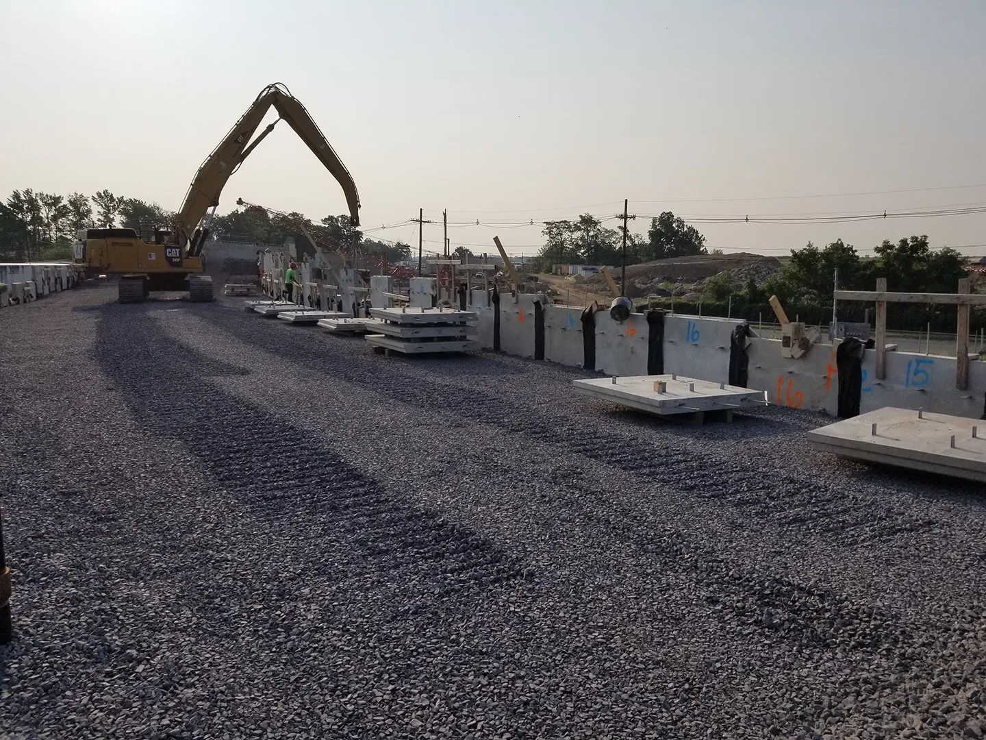 The bridge approach embankments were retained by MSE walls, which are supported through on ground improvements in lieu of surcharging these areas to accelerate overall construction duration.