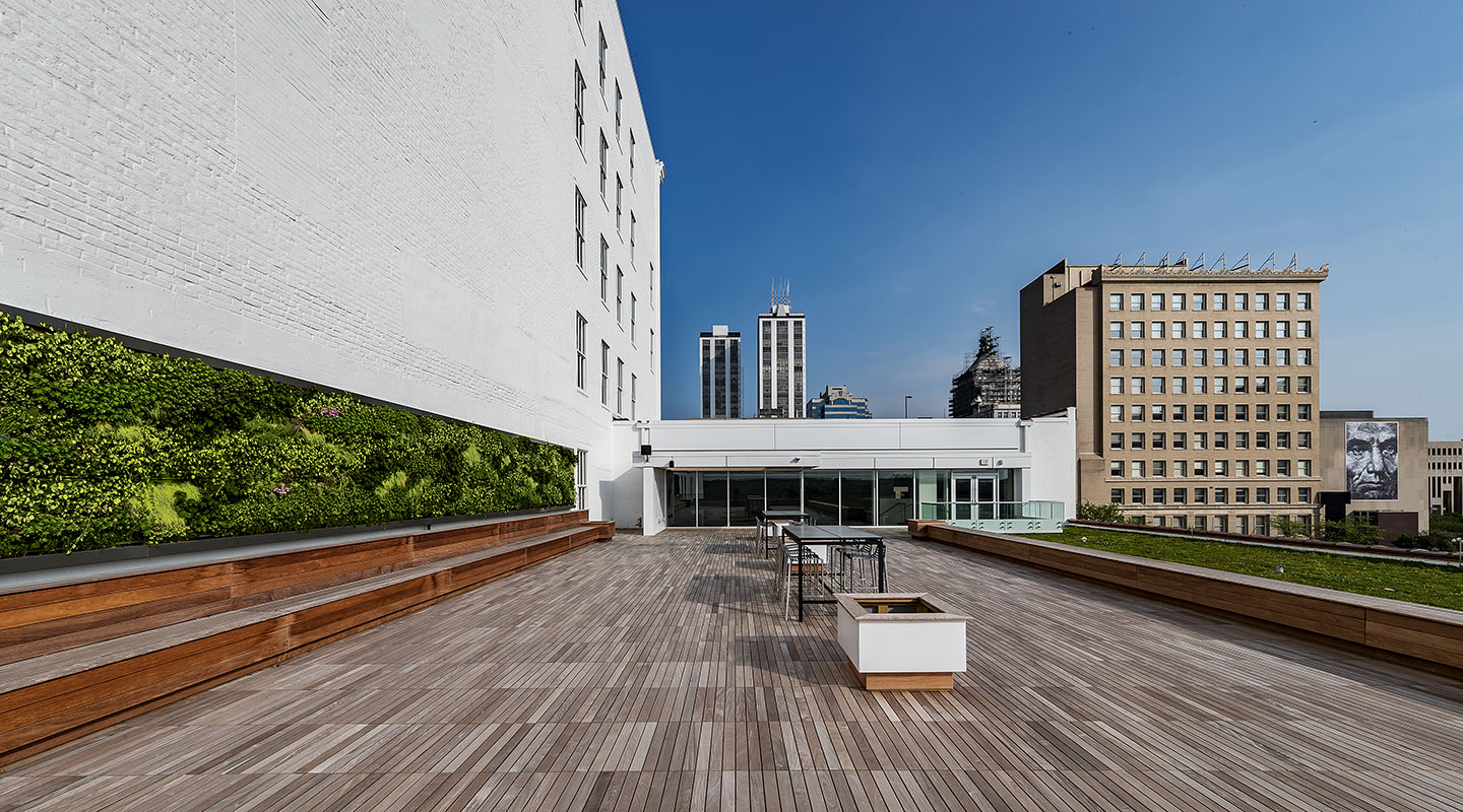 Due to controlled sight lines from the street level required by National Park Service standards, the roof of the annex building was the only opportunity to create outdoor space, which features a vegetative roof and living wall.